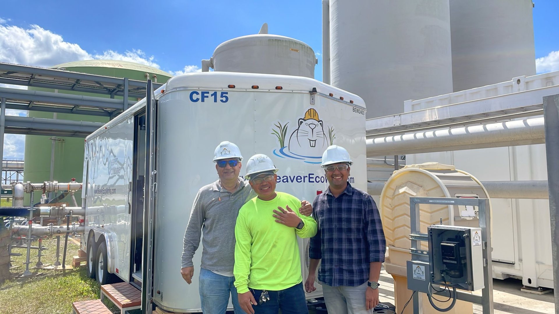 Beaver EcoWorks team on a customer site in front of the CF15 treatment trailer